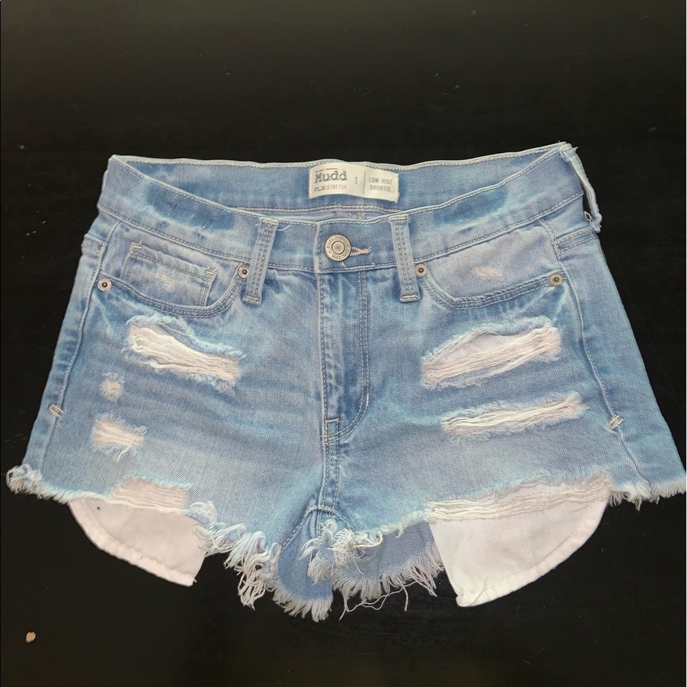 low rise blue ripped shorts